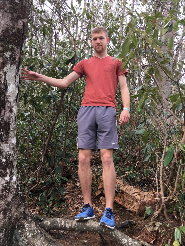 Jonny climbing off the trail