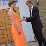 Marcus putting on Stephanie's Corsage